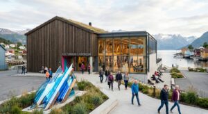A high-quality, professional editorial shot of a vibrant, modern Norwegian community cultural center