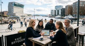 A professional editorial photograph showing a diverse group of people discussing a digital tablet in